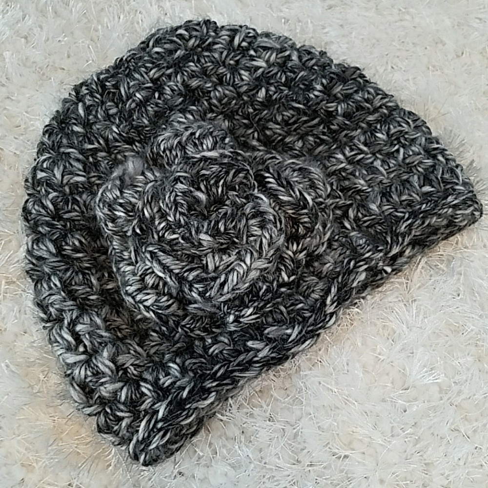 Crocheted hat, with flower on side